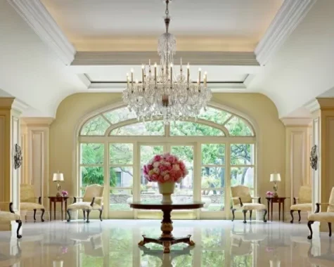 Elegant hotel lobby at The Langham Huntington Pasadena with chandelier, seating, and large windows