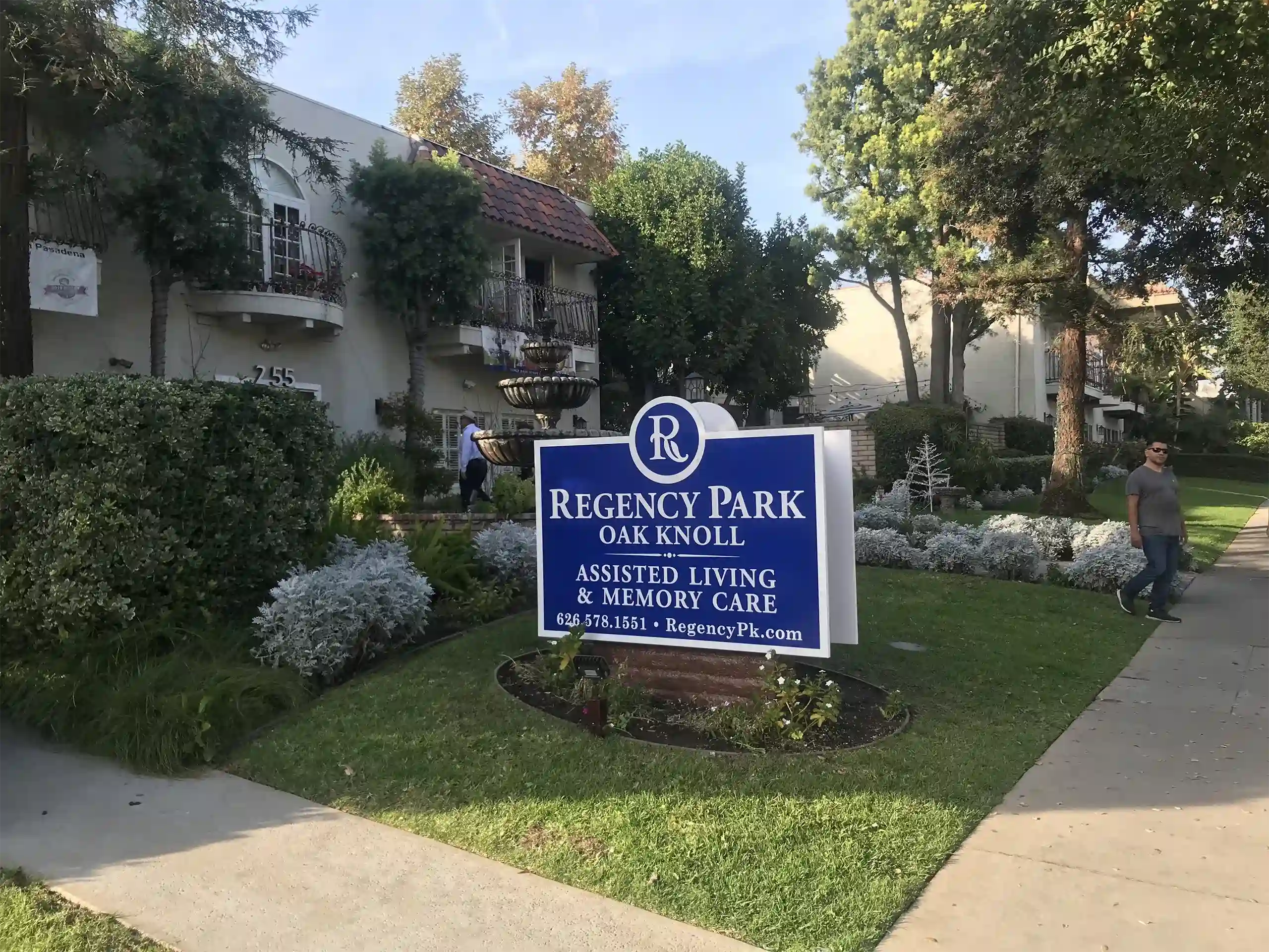 Blue sign of Regency Park Oak Knoll Assisted Living and Memory Care in Pasadena