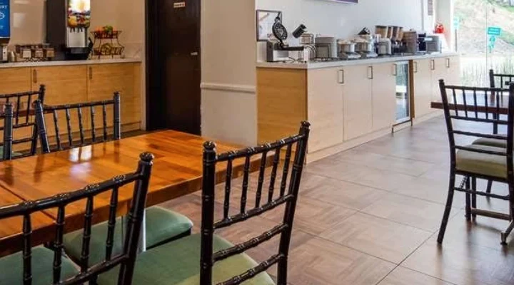 Breakfast room at Best Western Plus Glendale with buffet counter, coffee station, and dining tables.