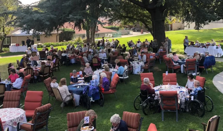 british_home_california_garden_event Residents and guests gathering outdoors at The British Home in Sierra Madre for a community garden event