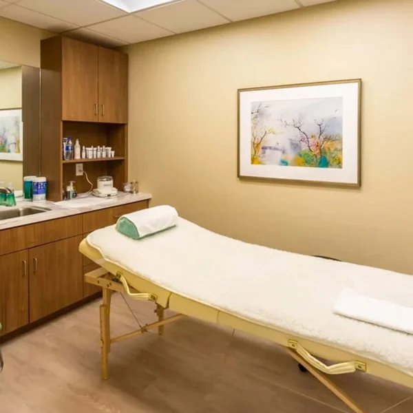 Cozy therapy room with massage table and soft lighting at Royal Oaks in Duarte CA
