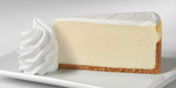 Slice of Original cheesecake with whipped cream at The Cheesecake Factory