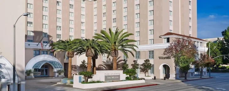 the-westin-pasadena-exterior-front Front view of The Westin Pasadena hotel entrance with palm trees on Los Robles Avenue.