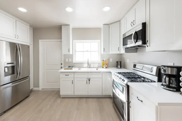 Bright shared kitchen at Rose Valley Garfias with modern appliances and clean layout supporting daily assisted living routines